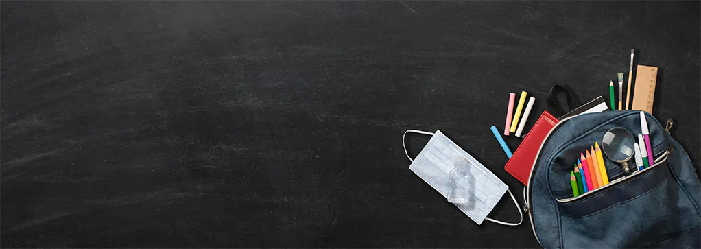 black chalkboard background with bookbag filled with pencils, pens, and other school supplies to the right.
