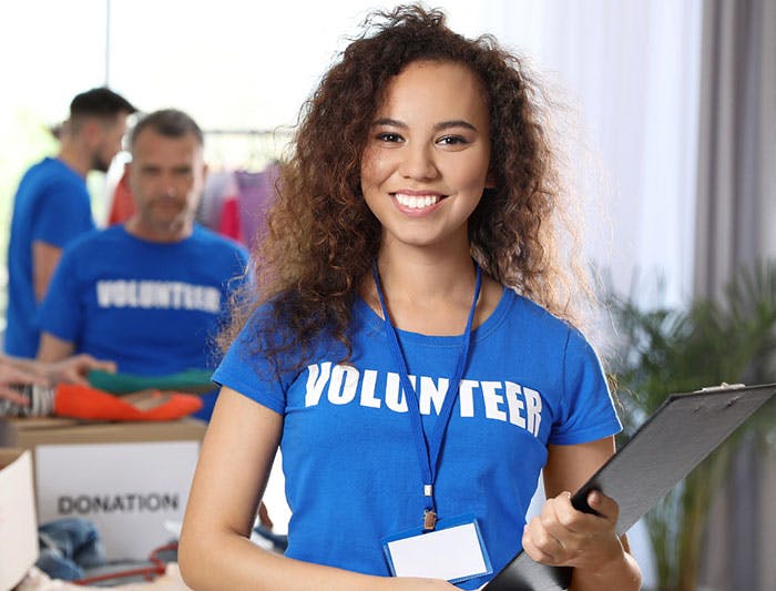 woman in volunteer shirt