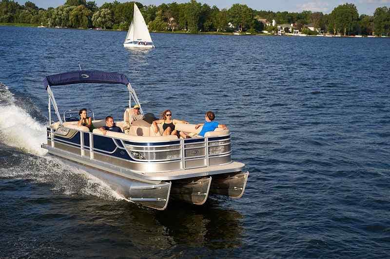 tritoon pontoon on lake