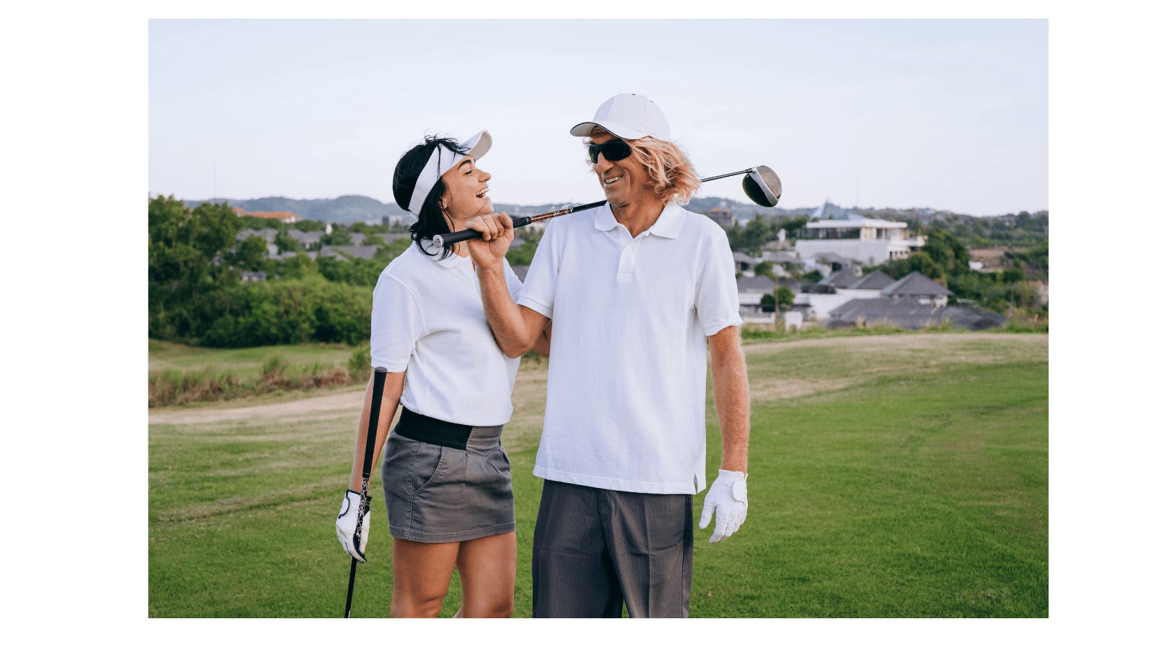 Golfers wearing white golf polo shirts