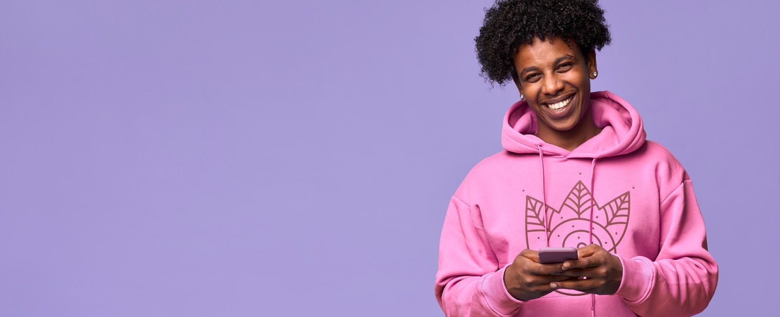 man wearing a pink logoed hoodie