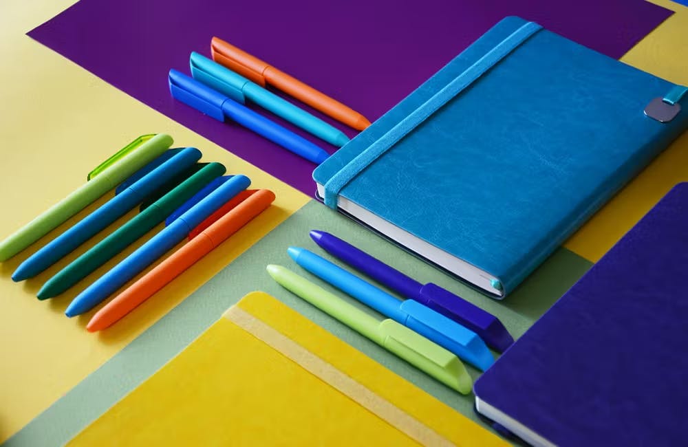 colorful pens and notebooks