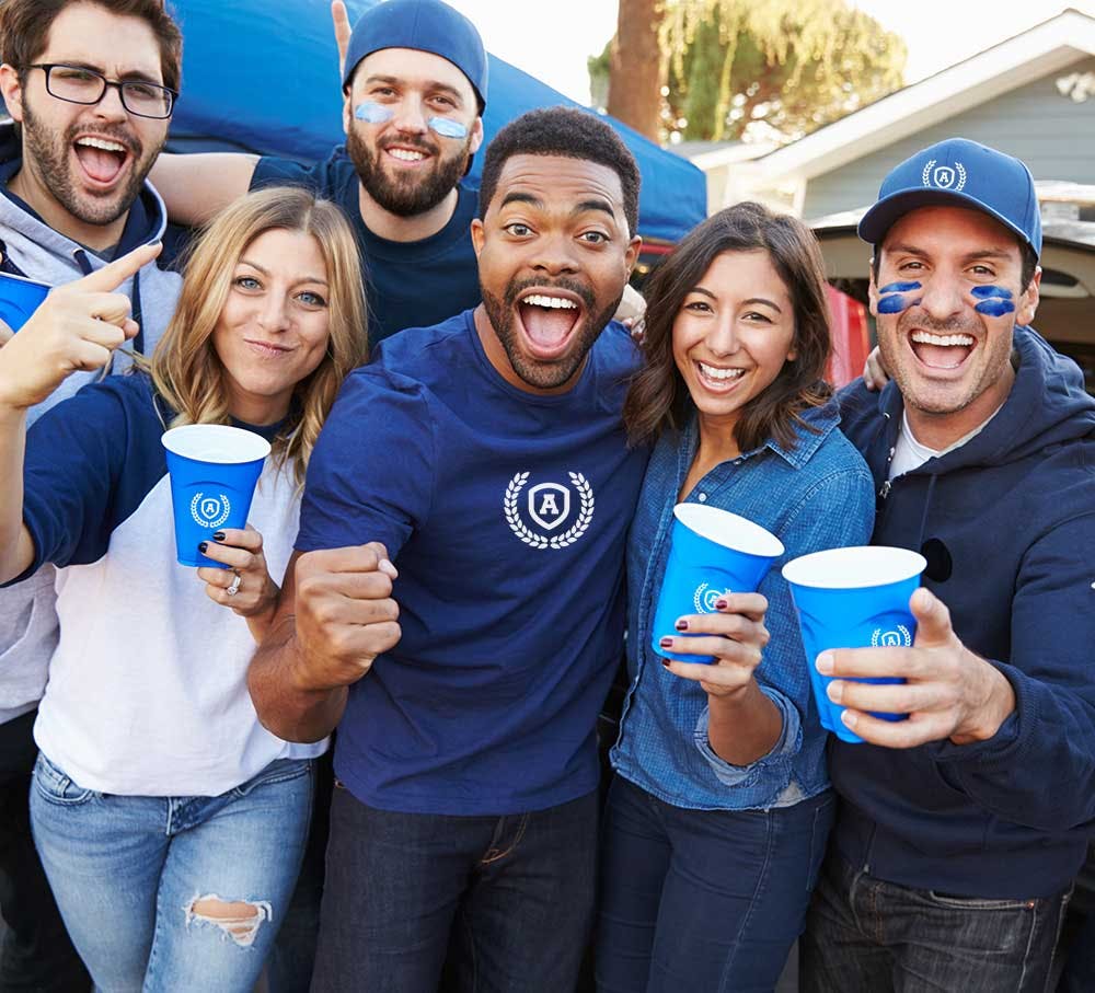 fans tailgating with blue cups