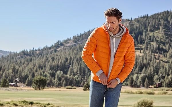 Man with orange jacket and gray hoodie