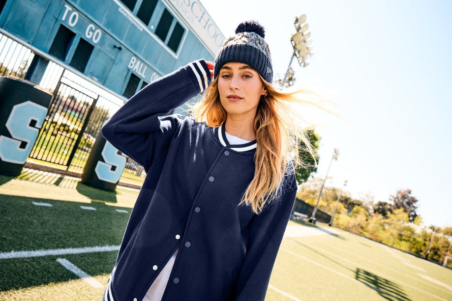 woman in New Era knit cap and jacket