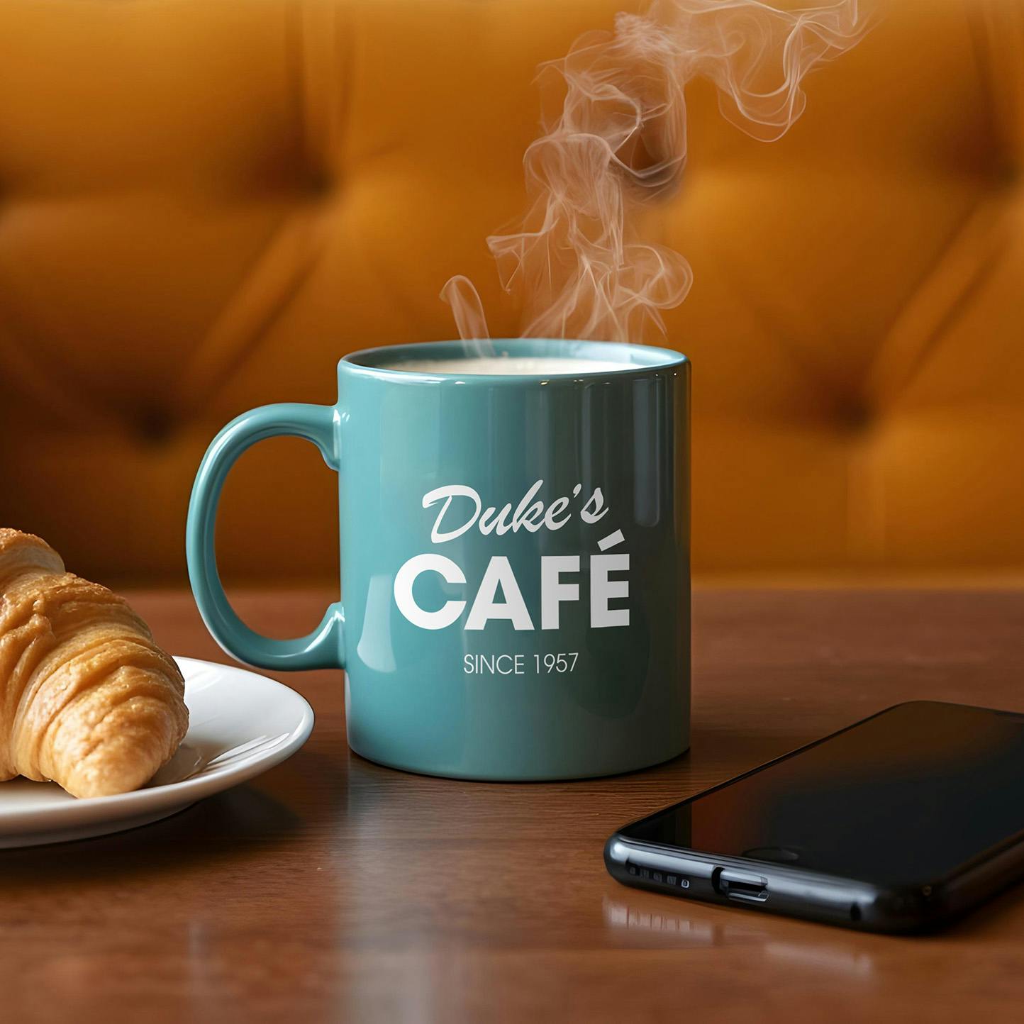 coffee mug in cafe with croissant