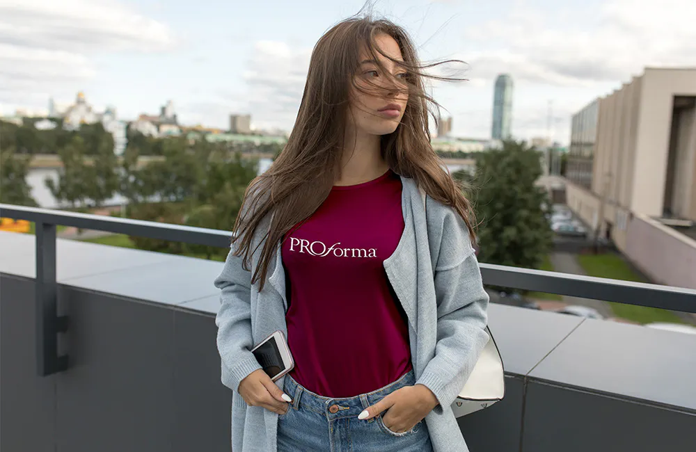 woman wearing a pink Proforma tshirt