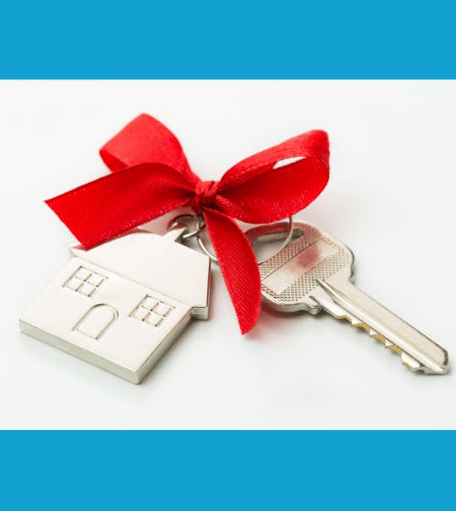 house keychain with red bow and key