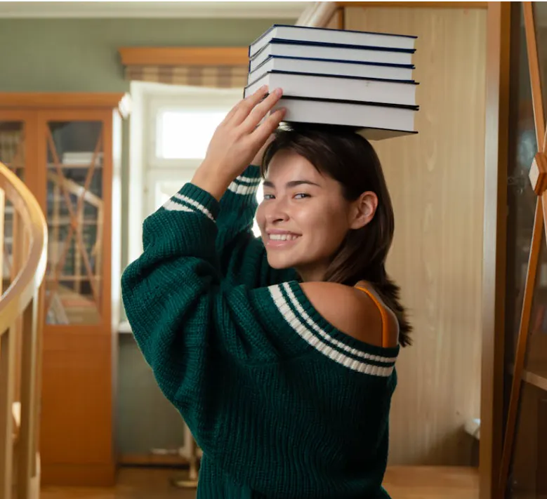 Girl holding books on head