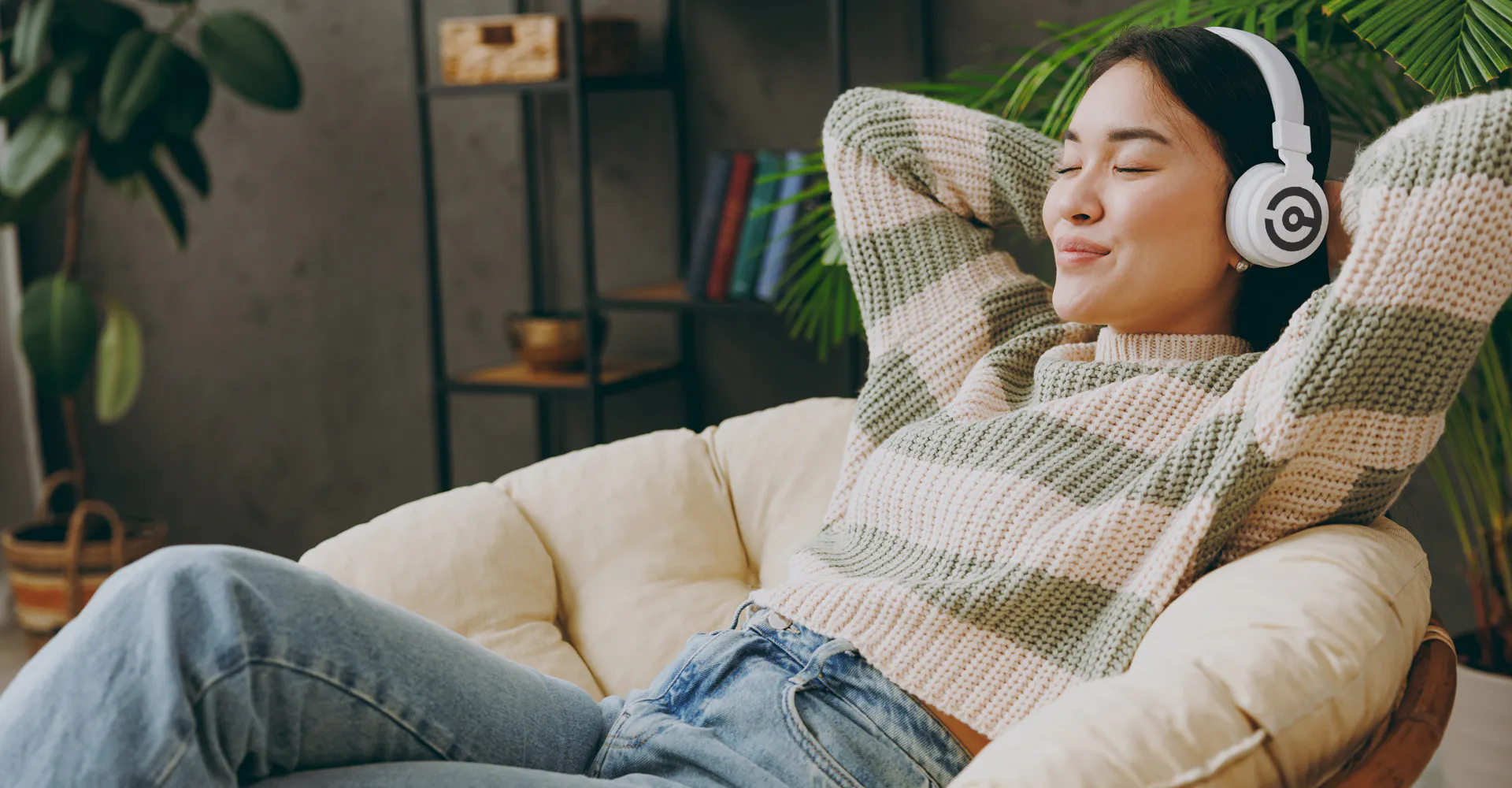 woman lounging in living room with headphones