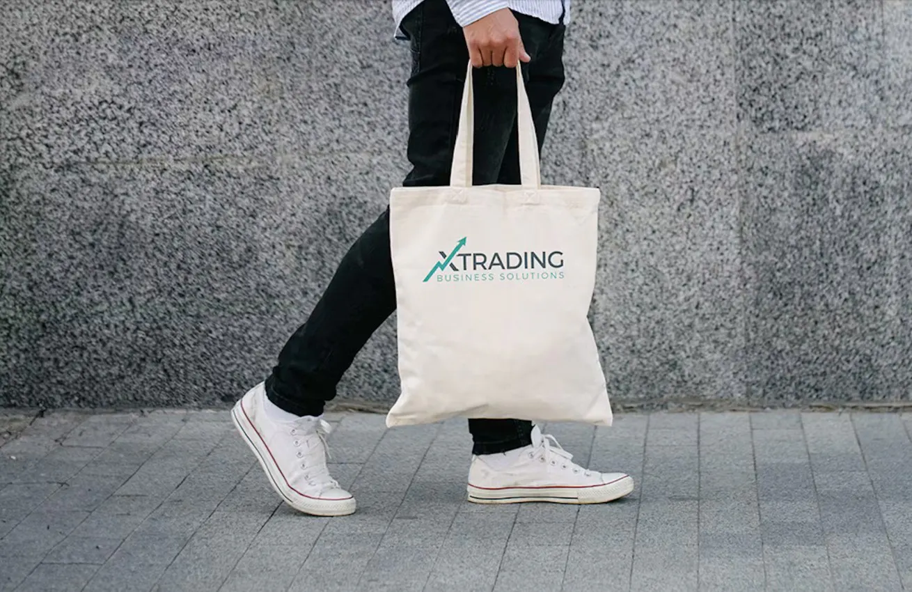 person with a tote walking down a street