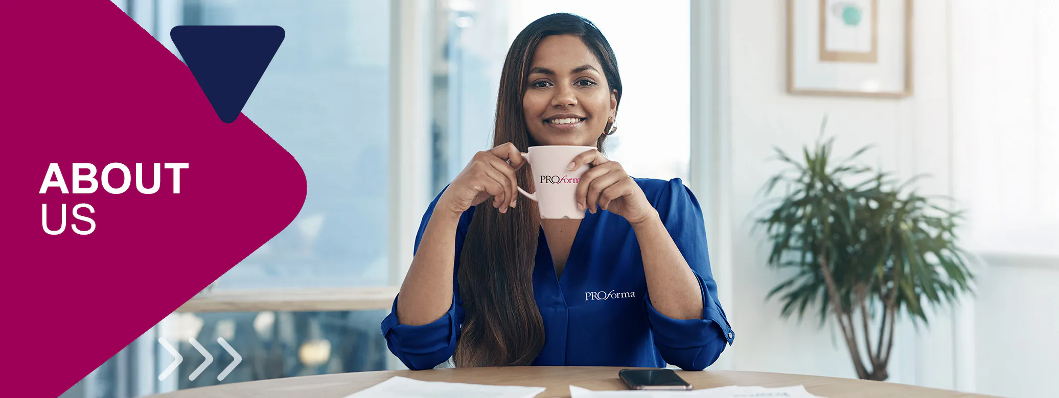 Woman wearing Proforma shirt and drinking from Proforma branded mug