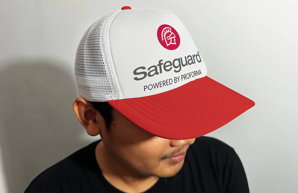 man wearing safeguard branded trucker hat
