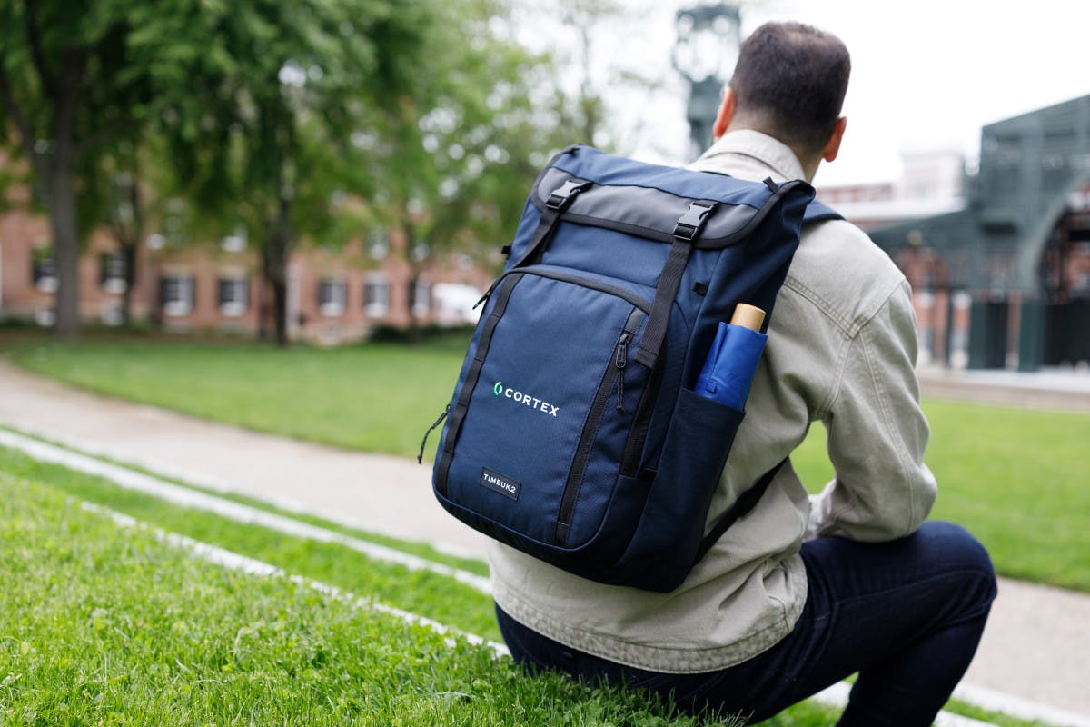 Timbuk2 backpack on back of man in park