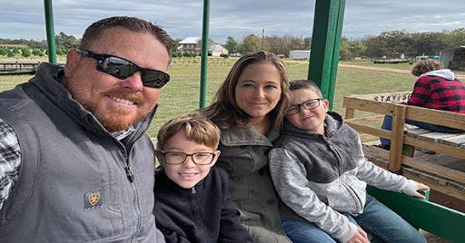 Family riding a hay cart