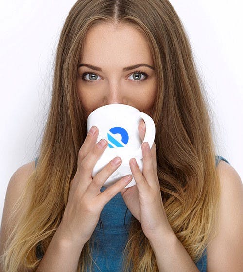 woman drinking from a mug