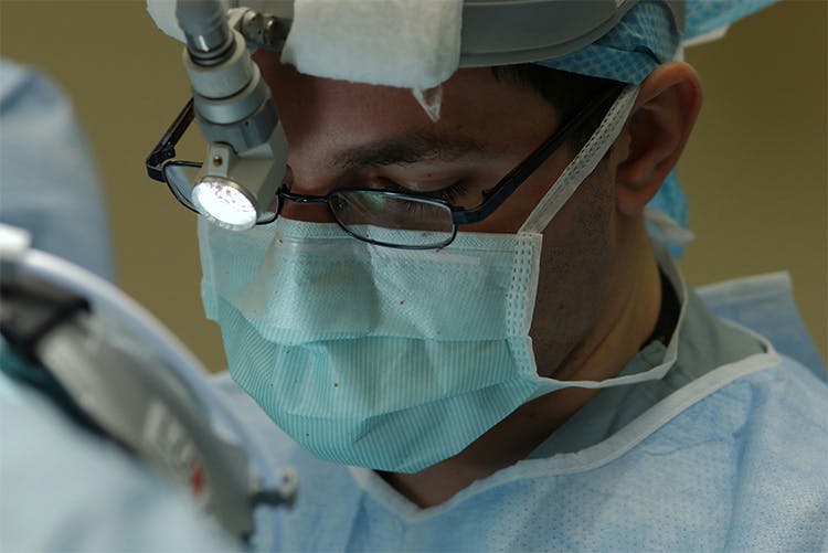 surgeon masked up midsurgery