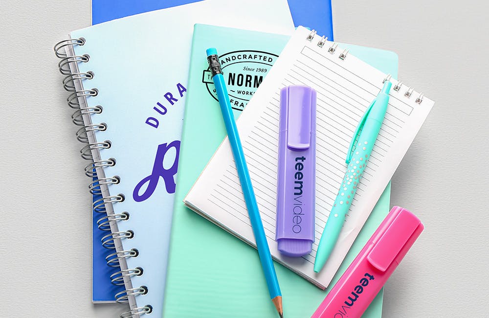 pens highlighters and notebooks