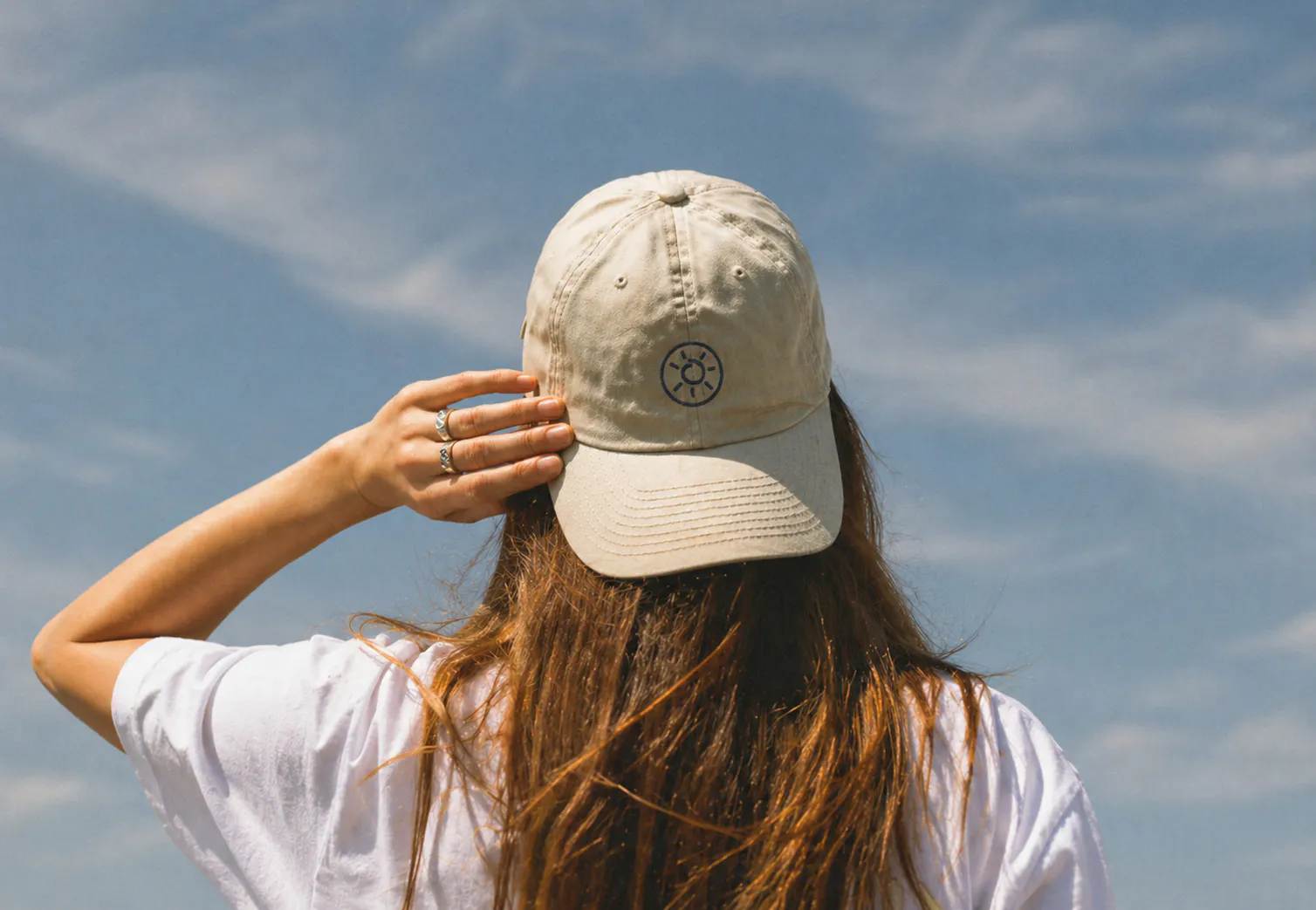 Black and white trucker hat on yellow background