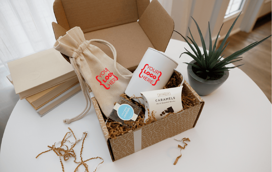 a product shot of a merchbox with snacks drinkware and various goodies