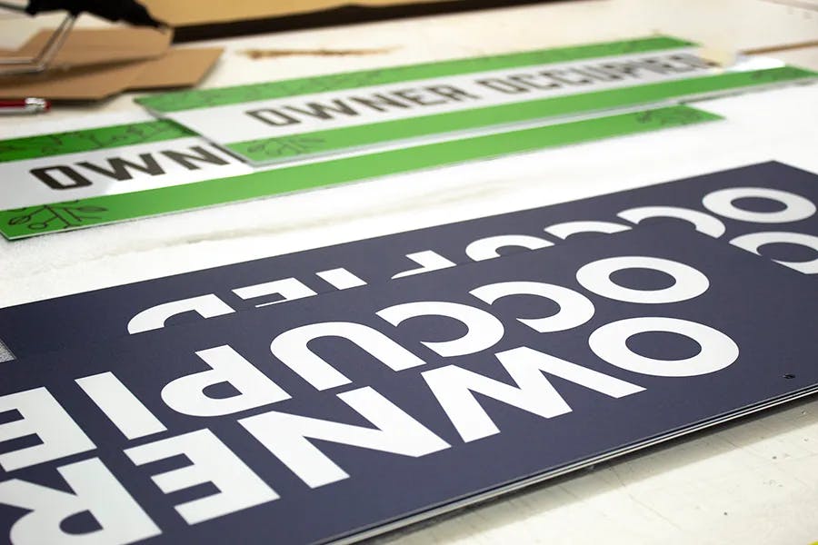 white lettering with blue and green background printed on 3 mm white max metsl