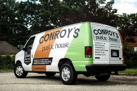 vehicle wrap for Conroys pug on white van