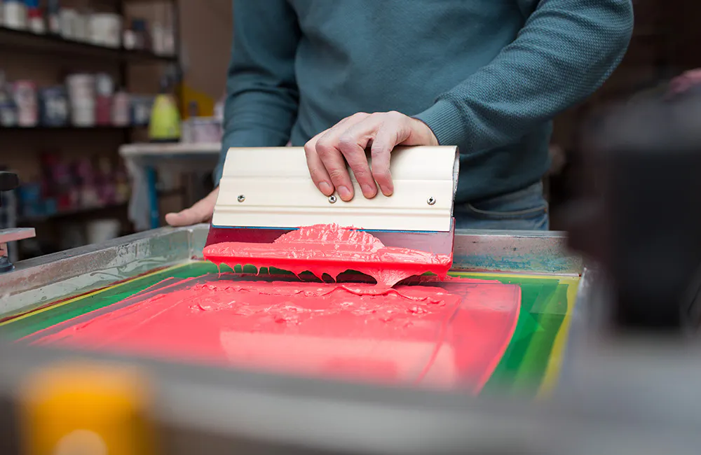 a person silk screening