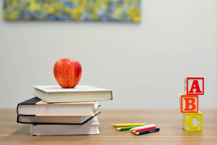 school books with ABC blocks