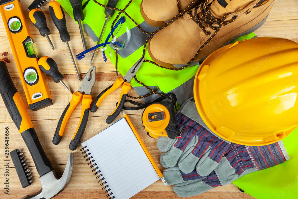 Safety gear and hi vis and tools on a table 