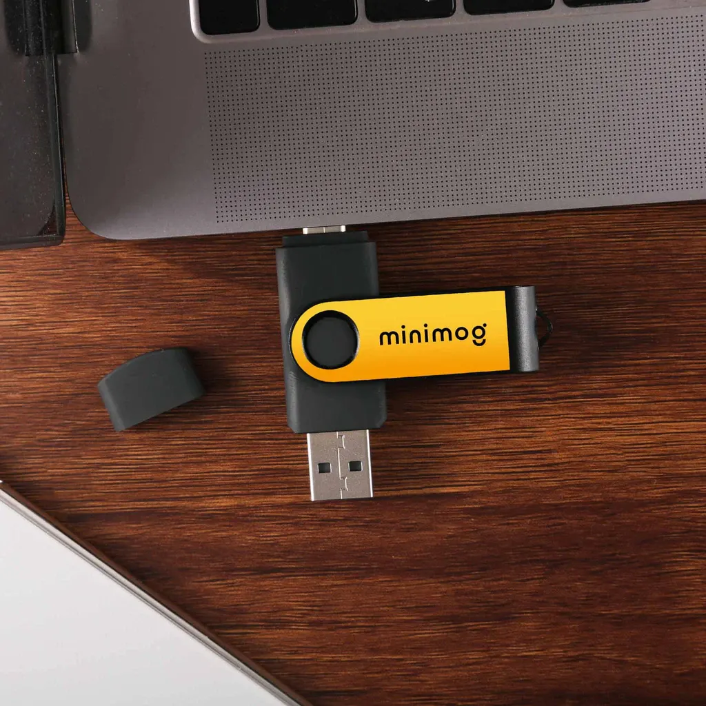 blue USB drive plugged into a laptop