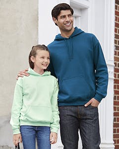 A man and young girl standing together wearing a mint and a blur hooded sweatshirt