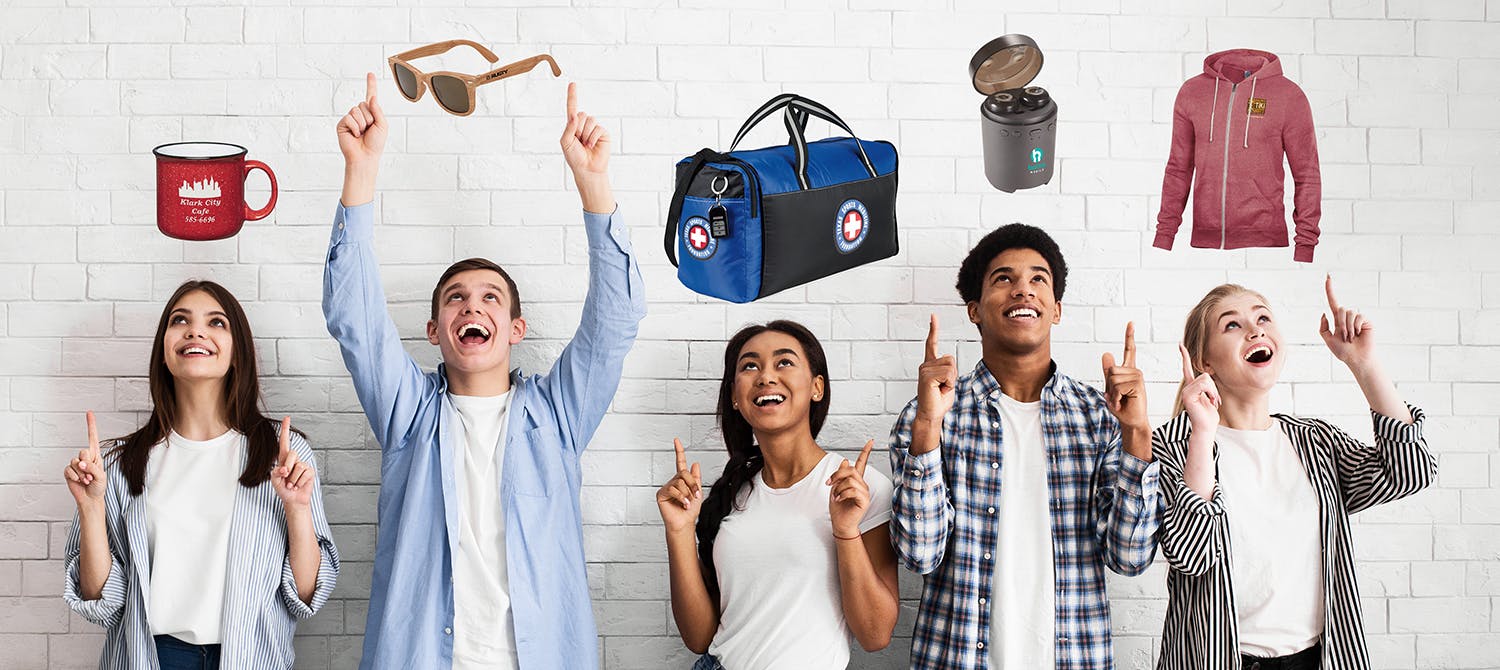 people reaching and pointing to promotional products