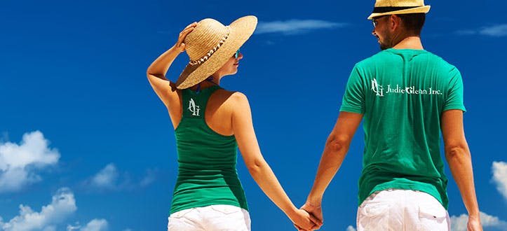 two people wearing green shirts