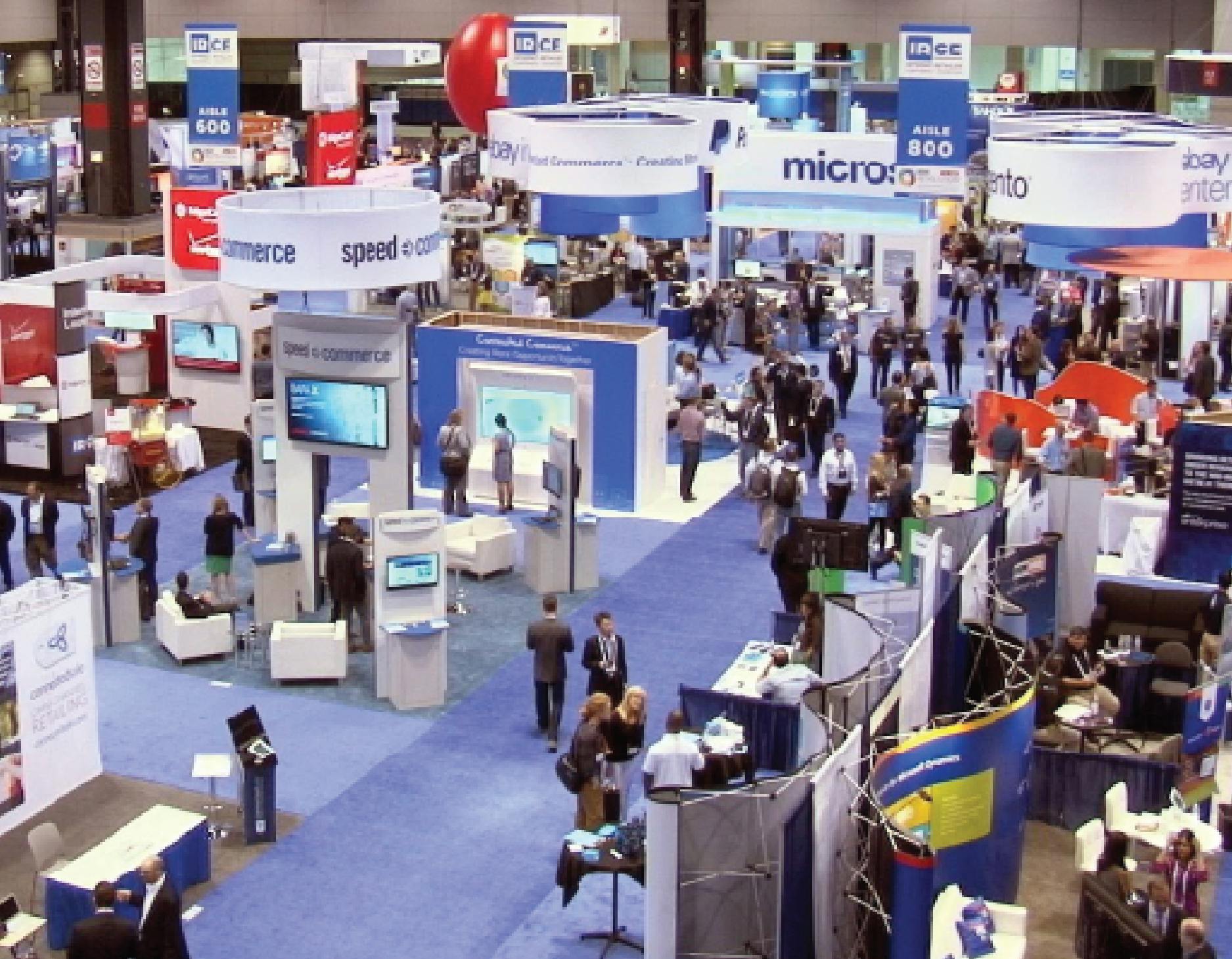 aA aerial view of a trade show showcasing signage and booths