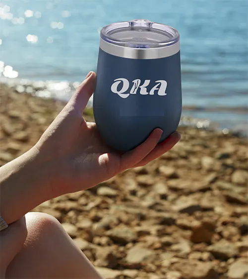 woman holding a tumbler