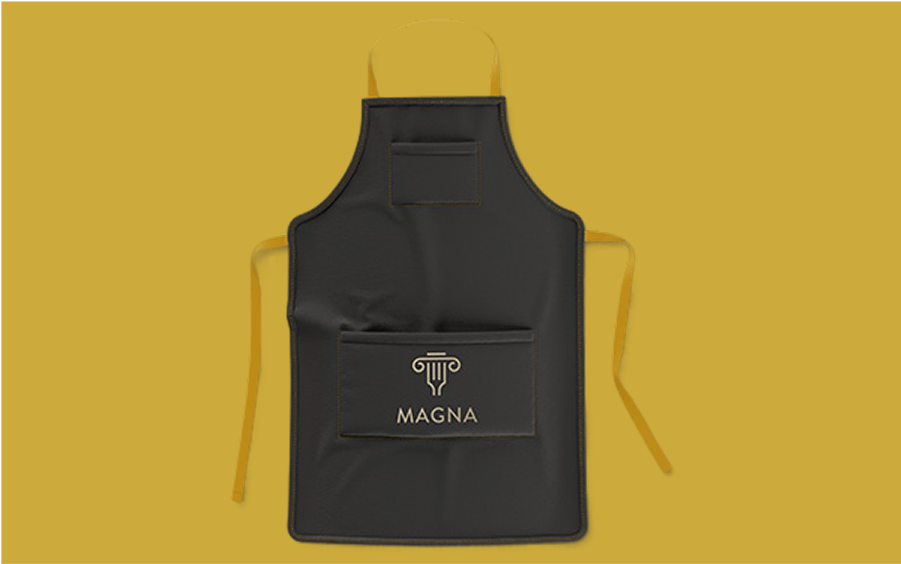 Black apron on a mustard yellow background