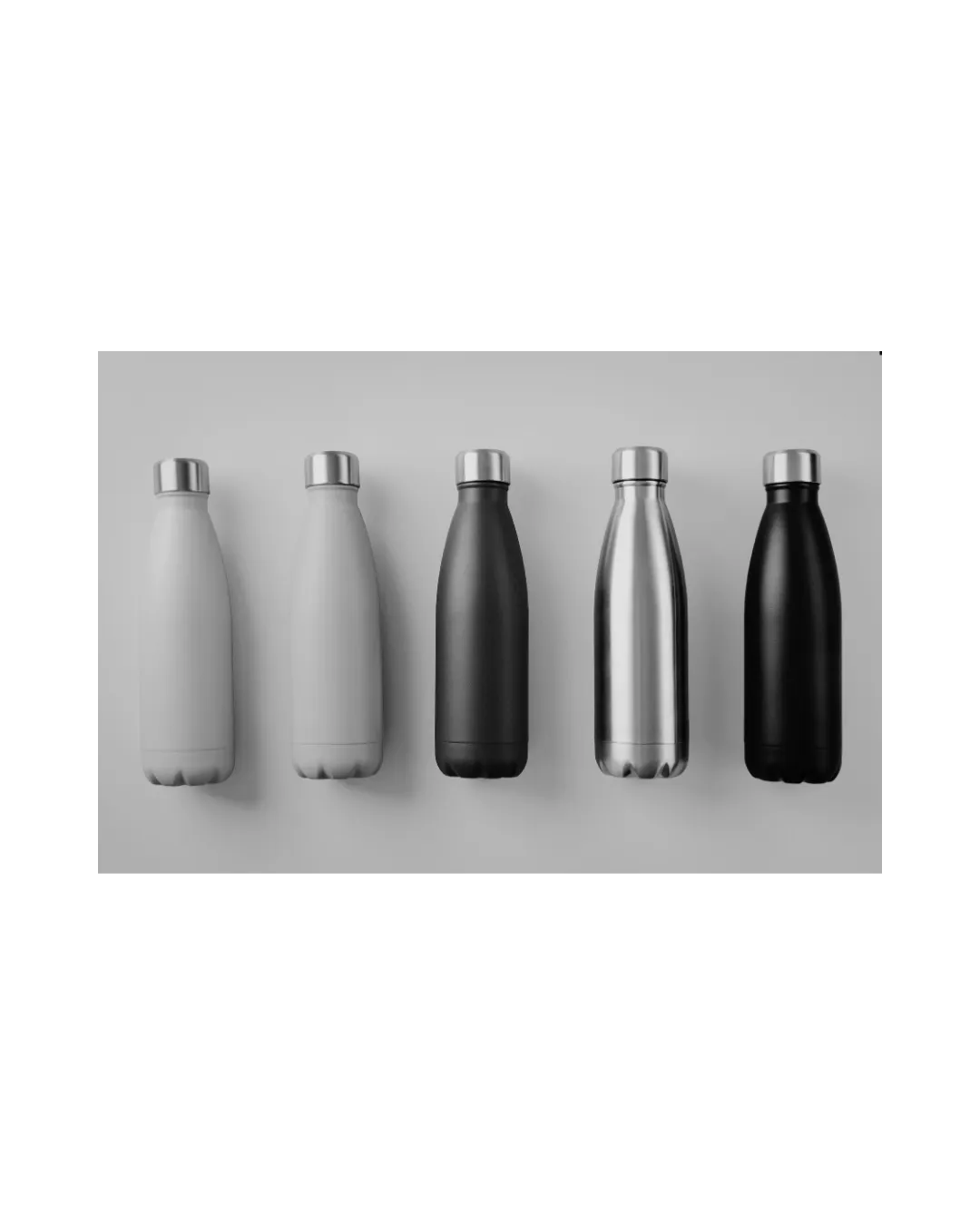 woman drinking from a reusable water bottle