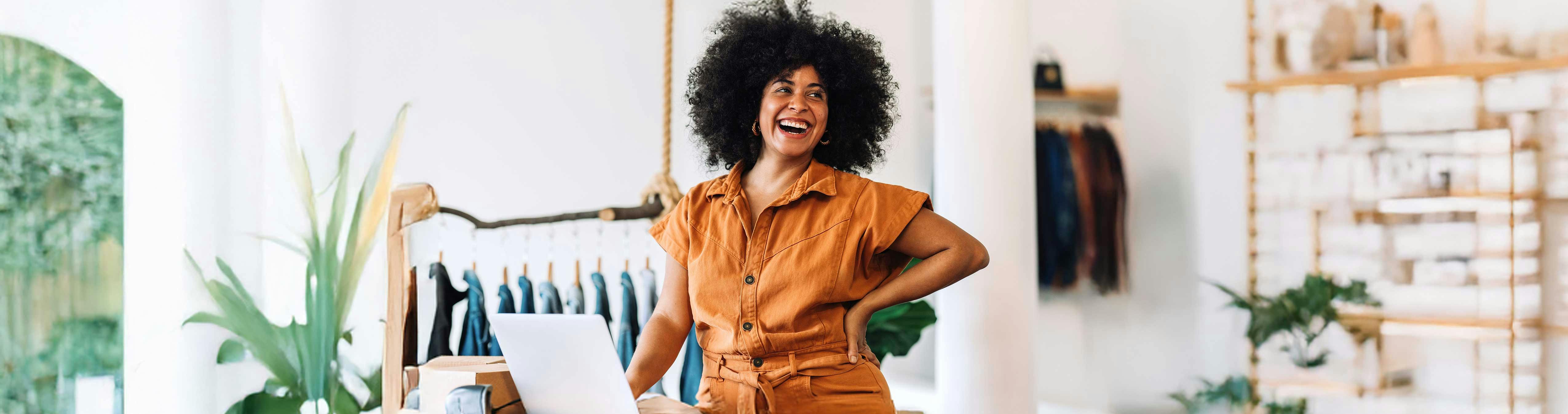 Two people wearing red and coral sweatshirts on a blue background 