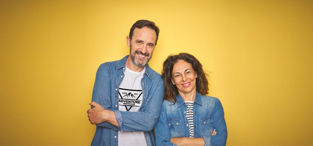 Two people wearing blue jean shirts