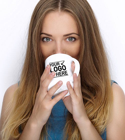woman drinking from coffee mug