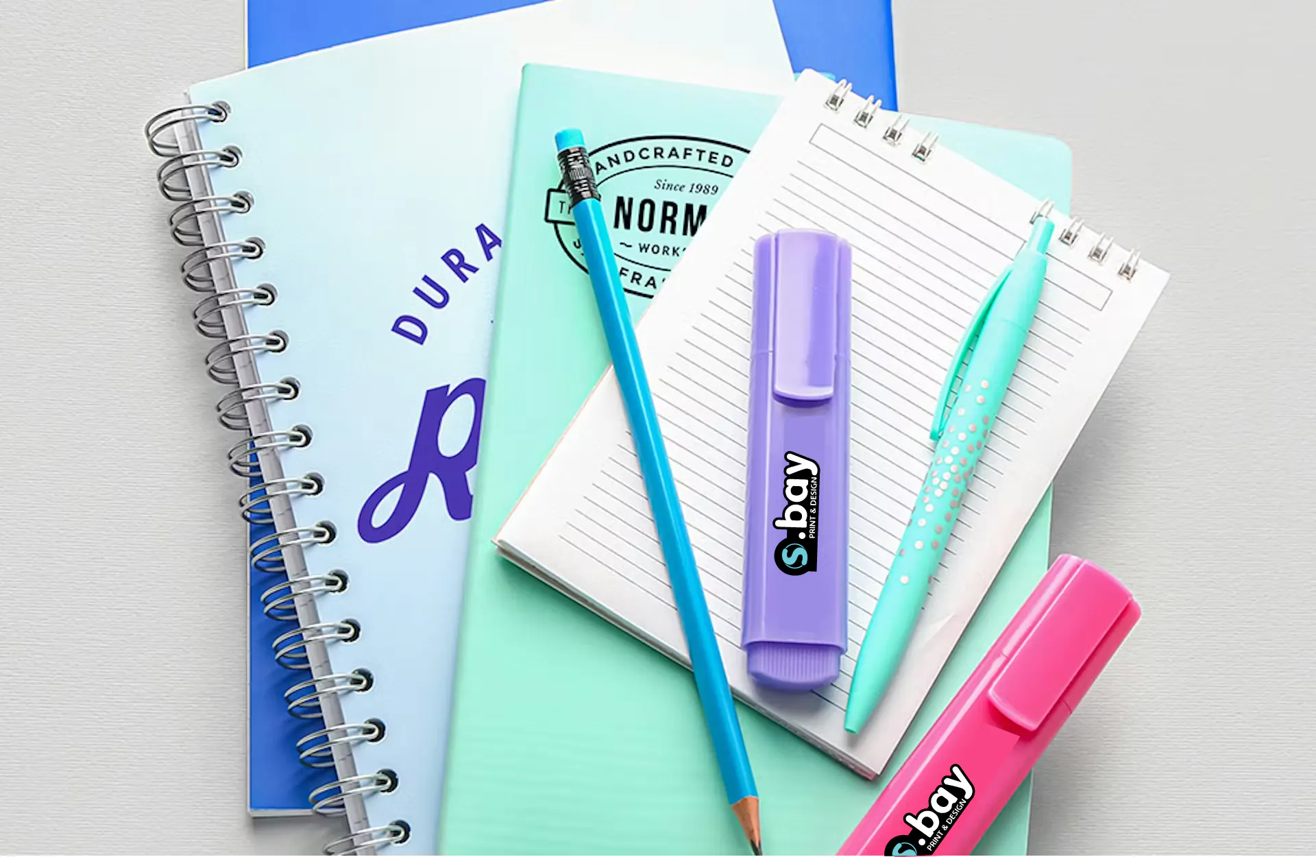 pens highlighters and notebooks