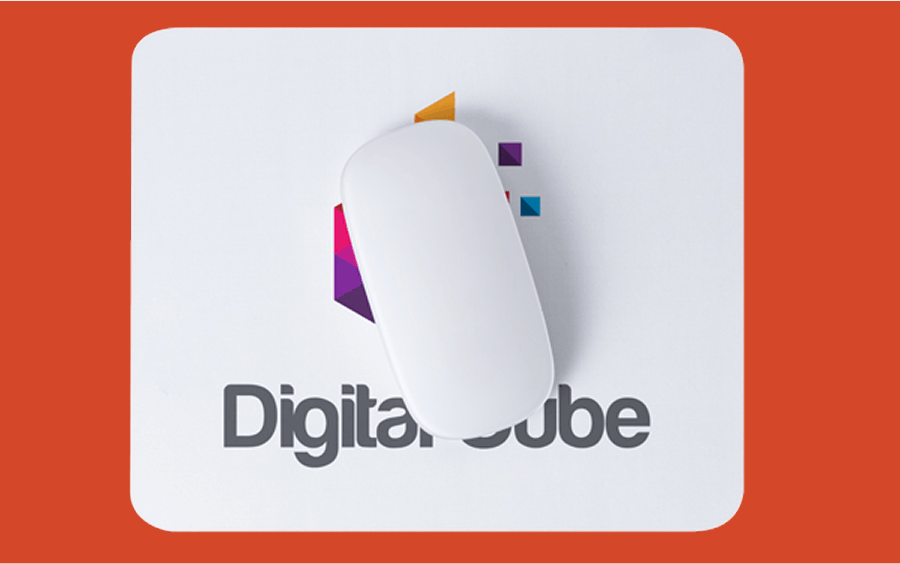 Computer mouse on a mousepad against a red background