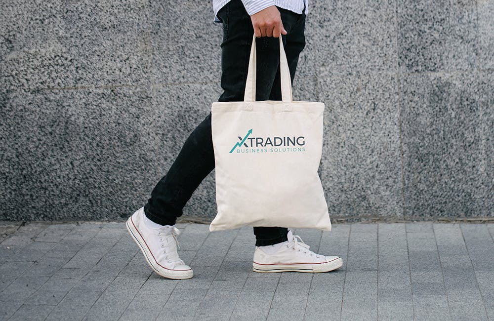 person walking with a tote bag