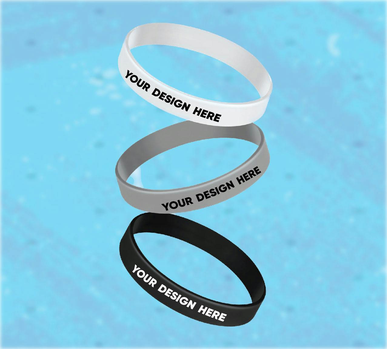 Multiple colored rubber wristbands on blue background