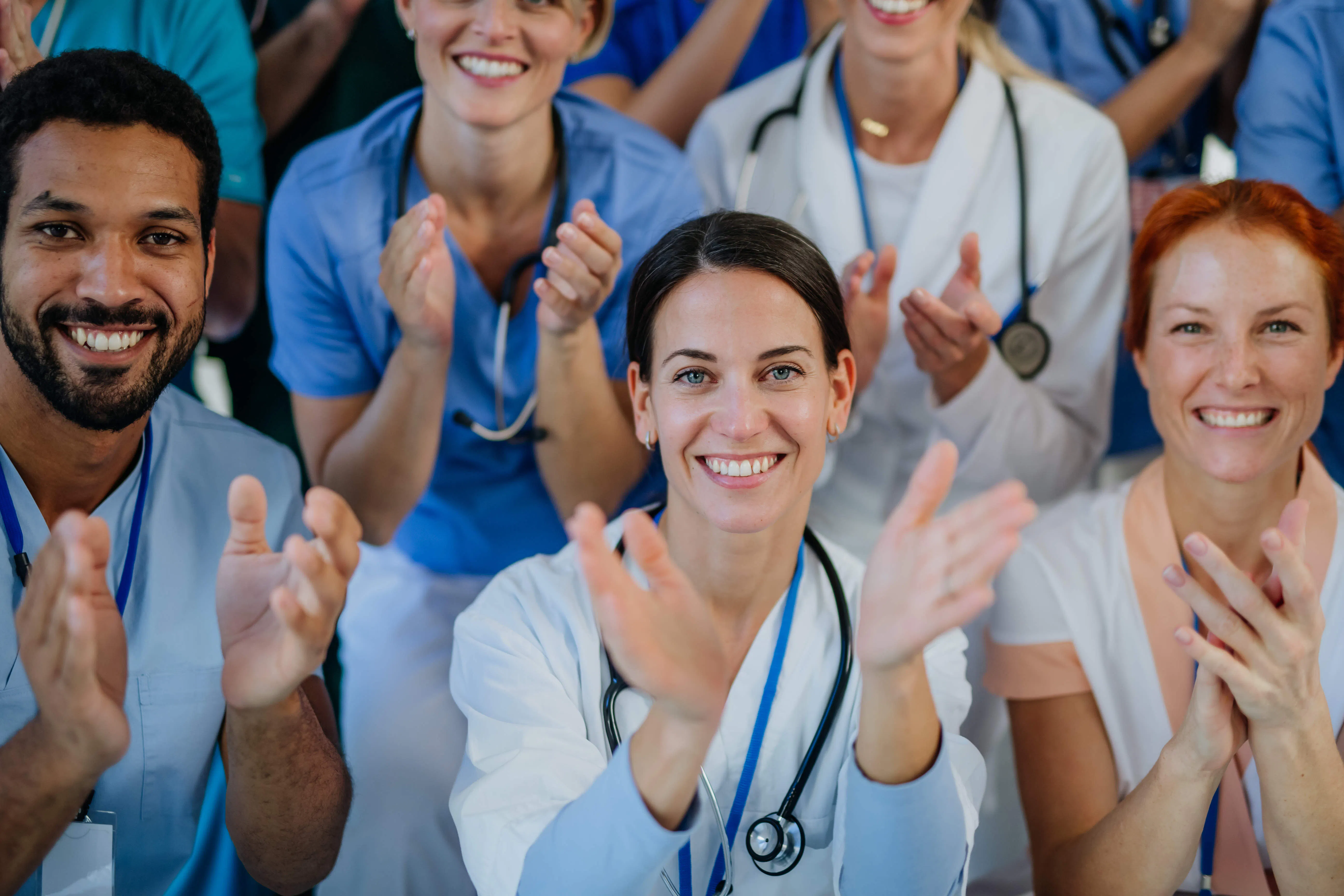 portrait-of-happy-doctors-nurses-and-other-medica-2026-03-10-02-02-26-utc