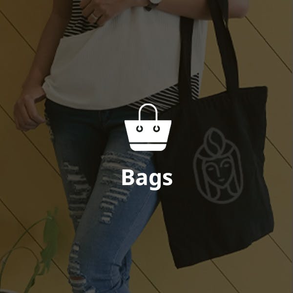 woman holding logoed tote bag