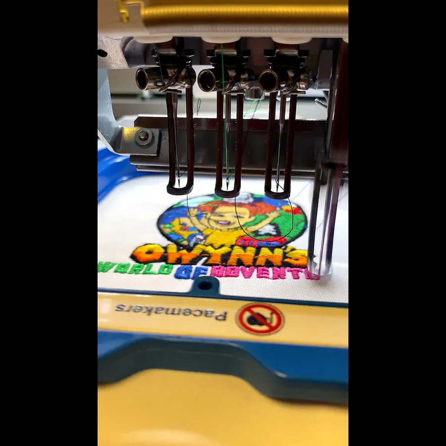 Our embroidery machine stitching a customer logo onto a garment