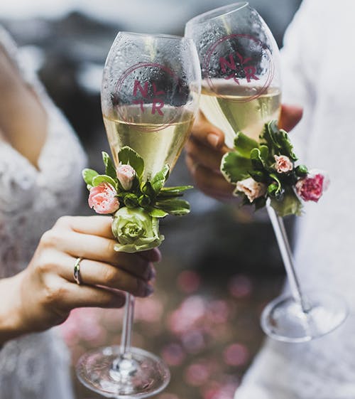 bride and groom toasting each other with glasses