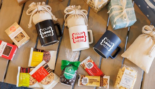 cereamic mugs on a table with snacks around