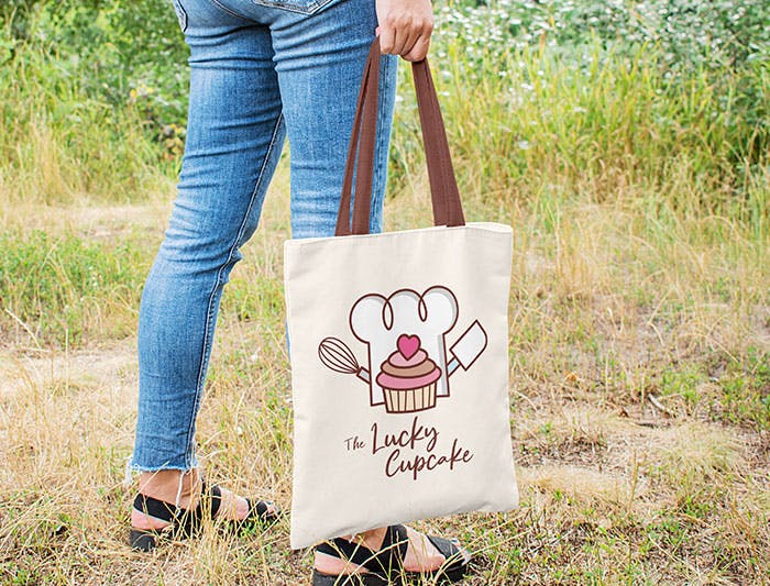 woman holding tote bag